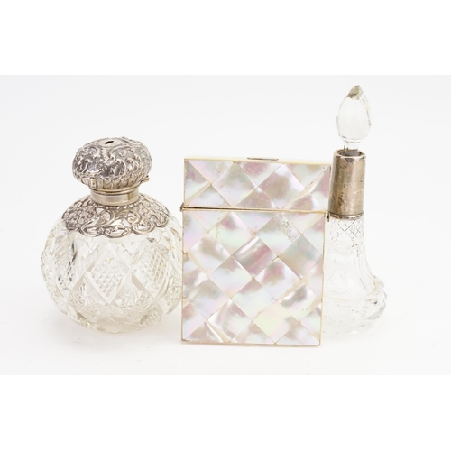 73 - A Silver mounted Cologne Bottle, an embossed Silver Scent Bottle & a Victorian Mother of Pearl Card ... 