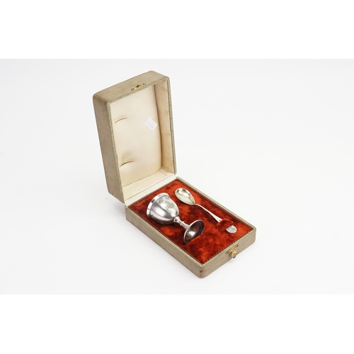 74 - A Continental Silver Engraved Egg Cup with a frosted finish & a similar Spoon in Original Case.