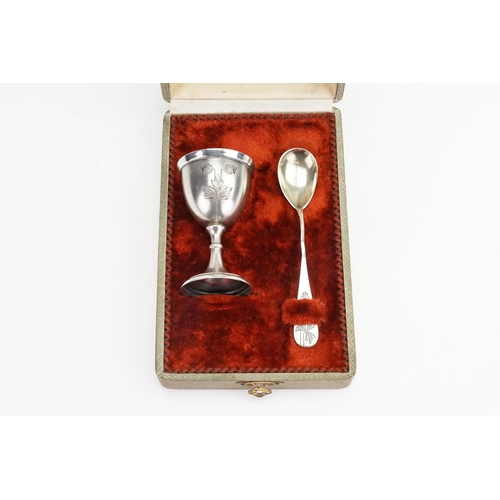 74 - A Continental Silver Engraved Egg Cup with a frosted finish & a similar Spoon in Original Case.