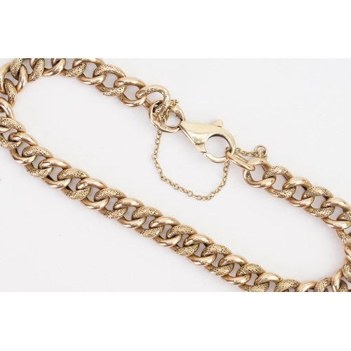 231 - A 9ct Gold Engraved Link Chain Bracelet with Safety Chain. Weighing: 10.2 grams.