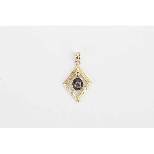 144 - A 18ct Gold tiger eye pendant.