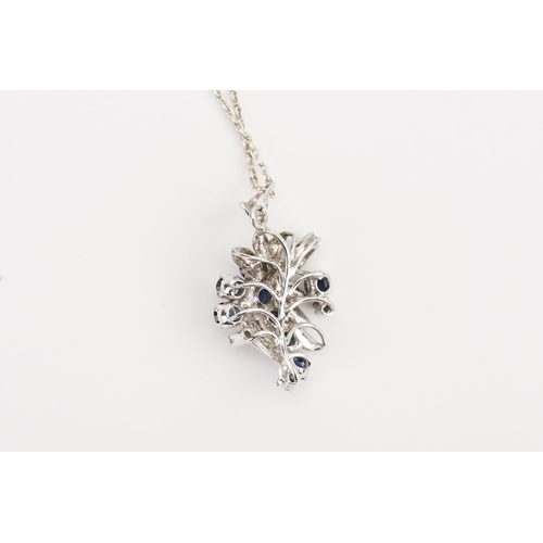 146 - A Silver Sapphire and paste necklace, hung on Silver chain. Weight: 5.8grams.