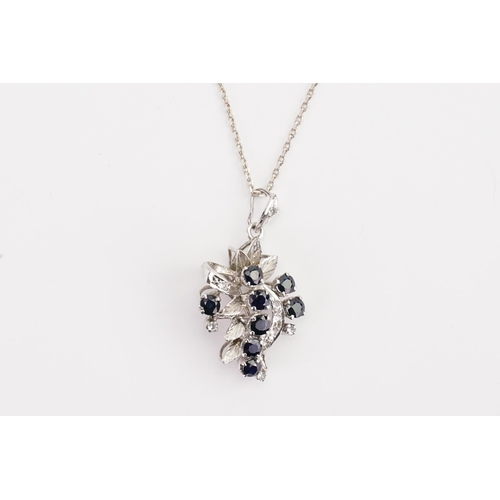 147 - A Silver Sapphire and paste necklace, hung on Silver chain. 5.8g