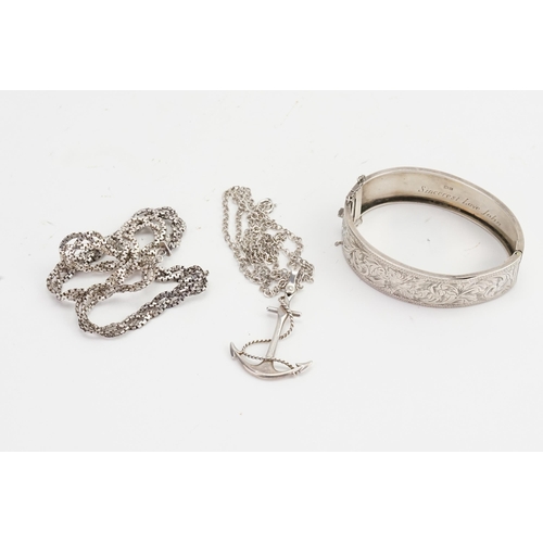 150 - A Silver bangle, along with a Silver chain, anchor and necklace. Weight 57g.