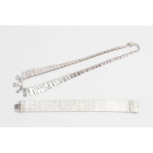 151 - A Silver Milanese bracelet and a bark effect necklace. Weight 57g.