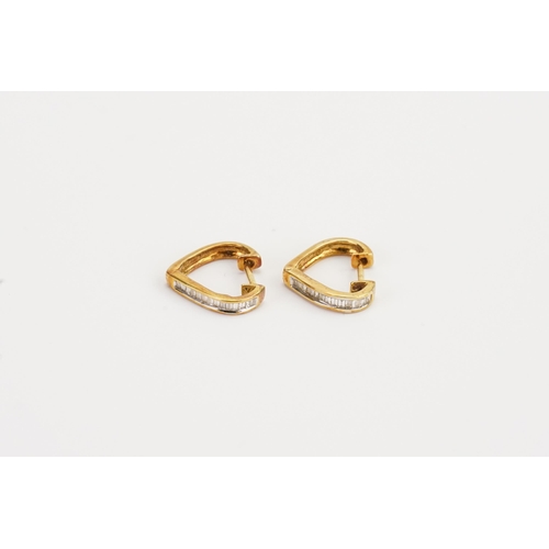 157 - A 18ct Gold pair of Diamond set earrings. Weight 3g.