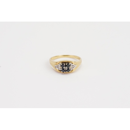 161 - A 18ct Gold Sapphire & Diamond set ring, set with 4 Sapphires and two diamonds. 4.3g. Size Q.