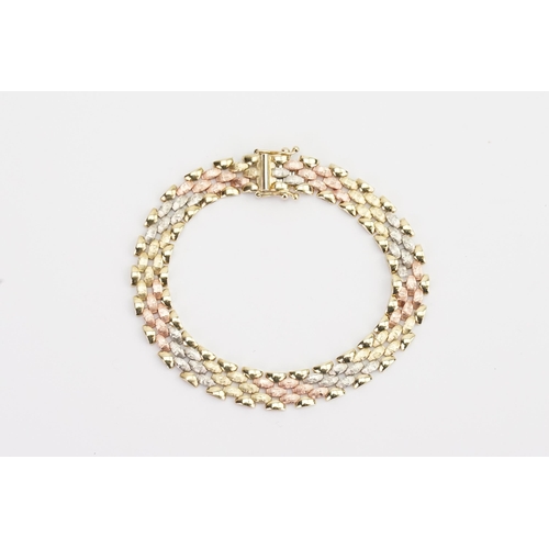 162 - A 9ct tri gold bracelet, fitted with safety clasp. 19cm long. Weight 10.2g.