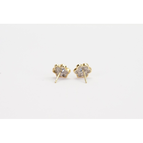 164 - A pair of Diamond and Sapphire set flower earrings. Weight: 2.4g. Sapphire size approx. 0.18ct.