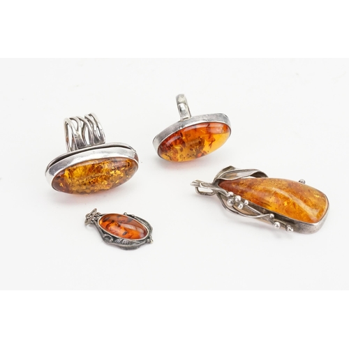 169 - A collection of Silver & Amber set jewellery. Weight 34g.