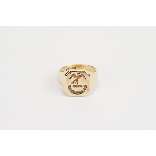 174 - A 9ct Gold Intaglio gentleman's signet ring. Set with a open winged eagle. SPES MEA CHRISTUS. Size S... 