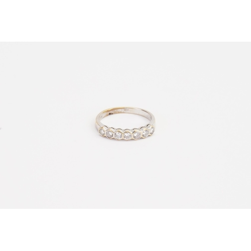 176 - A 18ct yellow & white gold half hoop diamond set ring. Weight 3g. Size N. 0.07ct each.