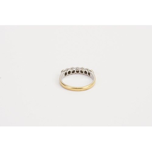 176 - A 18ct yellow & white gold half hoop diamond set ring. Weight 3g. Size N. 0.07ct each.