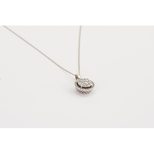 179 - A 9ct white Gold chain, hung with a 9ct Diamond pendant. In the cluster design. Largest Diamond 0.91... 