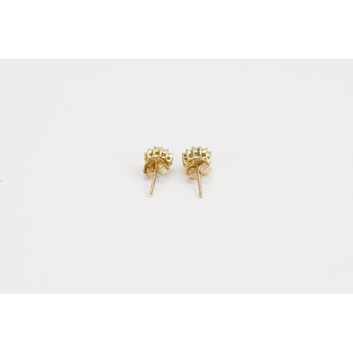 182 - A pair of 9ct Gold Diamond set cluster earrings. Weight 1g.