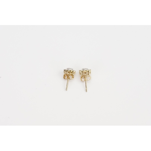 182 - A pair of 9ct Gold Diamond set cluster earrings. Weight 1g.