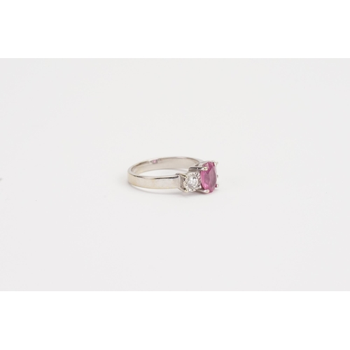 210 - A 18ct white Gold Pink Sapphire and Diamond ring, set with a 7.13mm x 5.20mm oval cut pink Sapphire.... 