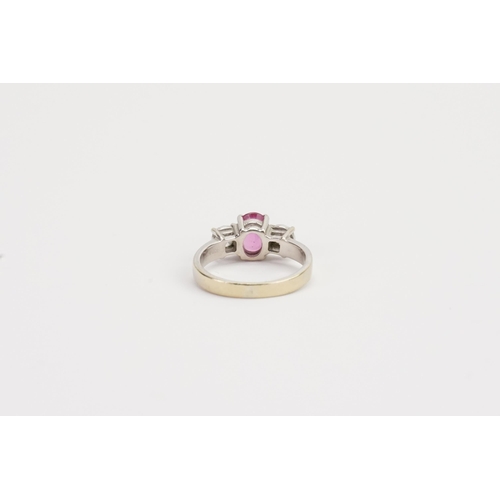 210 - A 18ct white Gold Pink Sapphire and Diamond ring, set with a 7.13mm x 5.20mm oval cut pink Sapphire.... 