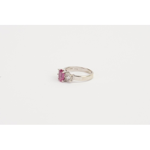 210 - A 18ct white Gold Pink Sapphire and Diamond ring, set with a 7.13mm x 5.20mm oval cut pink Sapphire.... 