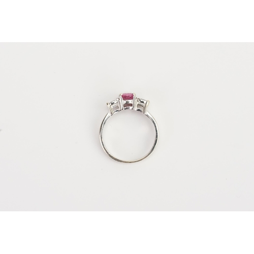 210 - A 18ct white Gold Pink Sapphire and Diamond ring, set with a 7.13mm x 5.20mm oval cut pink Sapphire.... 