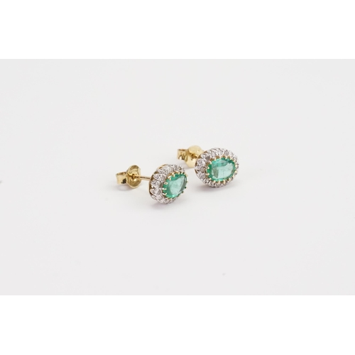 211 - A pair of 9ct Gold oval set Emerald and Diamond earrings. Size 7.8mm x 5.2mm. Weight 2.5g.