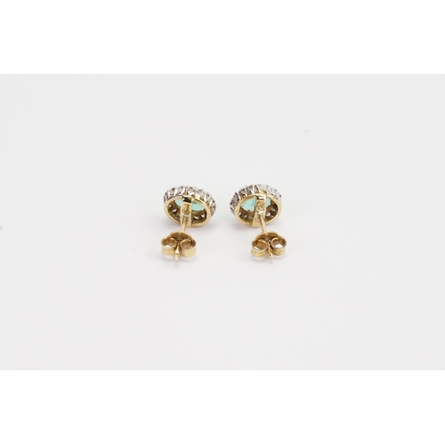 211 - A pair of 9ct Gold oval set Emerald and Diamond earrings. Size 7.8mm x 5.2mm. Weight 2.5g.