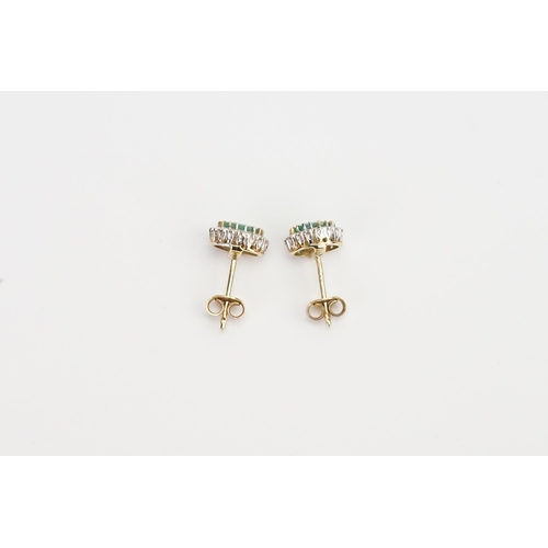 211 - A pair of 9ct Gold oval set Emerald and Diamond earrings. Size 7.8mm x 5.2mm. Weight 2.5g.