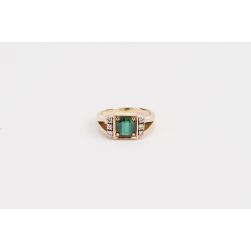 216 - A 18ct Dimond and Emerald ring. Size of Emerald 6mm x 6mm. Weight 5.7g. Size M.