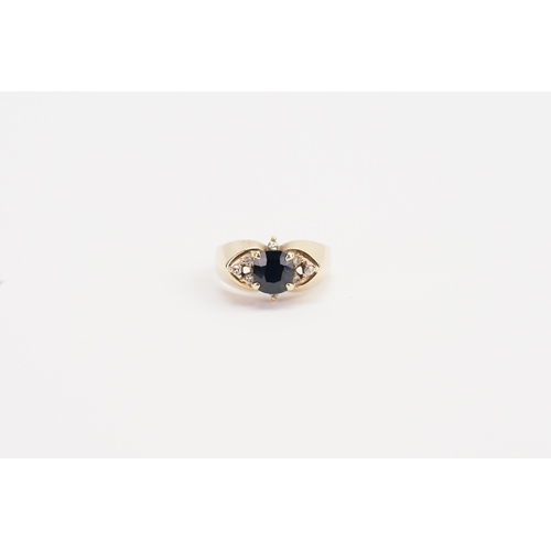 218 - A 14ct yellow Gold diamond and Sapphire set ring, set with 8 chip diamonds. Sapphire size 6.7mm x 6m... 