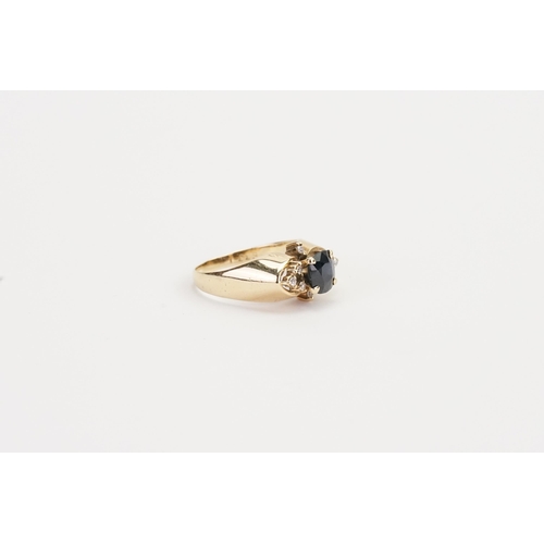 218 - A 14ct yellow Gold diamond and Sapphire set ring, set with 8 chip diamonds. Sapphire size 6.7mm x 6m... 