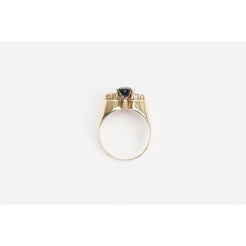 218 - A 14ct yellow Gold diamond and Sapphire set ring, set with 8 chip diamonds. Sapphire size 6.7mm x 6m... 