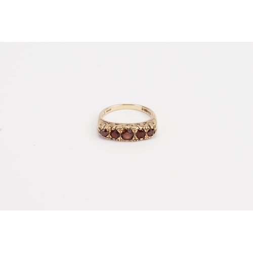 219 - A 9ct Gold 5 stone Garnet set ring. Weight 4g. Size M.