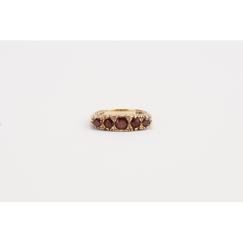 219 - A 9ct Gold 5 stone Garnet set ring. Weight 4g. Size M.