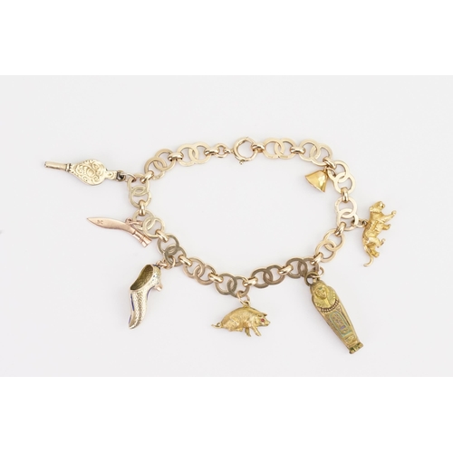 118 - A 9ct Gold double hoop charm bracelet, set with various charms to include a tiger, etc. Weight 25.2g... 