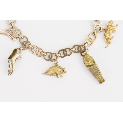 118 - A 9ct Gold double hoop charm bracelet, set with various charms to include a tiger, etc. Weight 25.2g... 