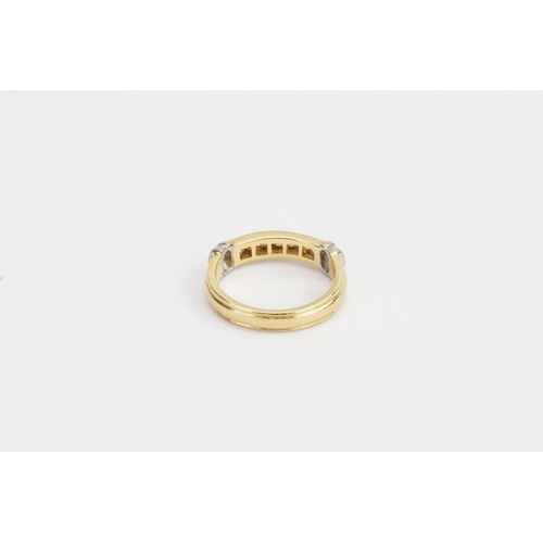 122 - A ladies 18ct Gold wedding band, set with 7 Diamonds. Weight 4.7g. Size M.