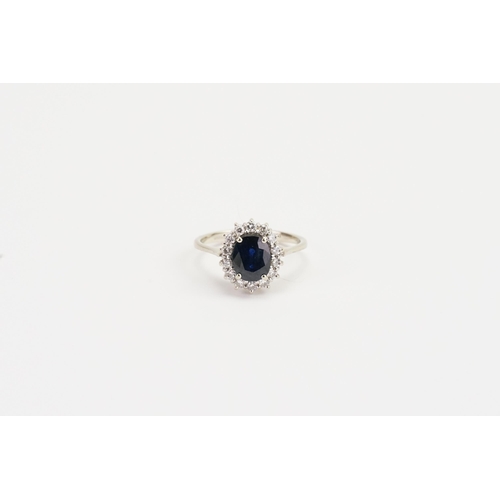 187 - An 18ct Gold Diamond and Sapphire set Ring set with an approximate 1ct oval Sapphire and 14 diamonds... 