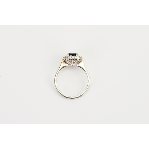 187 - An 18ct Gold Diamond and Sapphire set Ring set with an approximate 1ct oval Sapphire and 14 diamonds... 