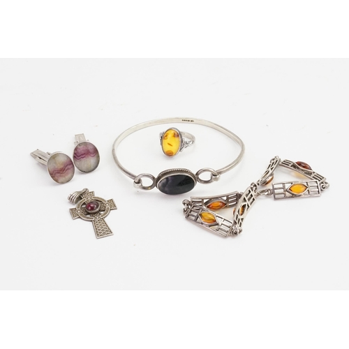 200 - A Collection of Amber to include Rings, Earrings & Keltic Cross.