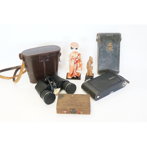 798 - A Kodak folding box camera, along with a pair of binoculars, a Japanese doll etc.