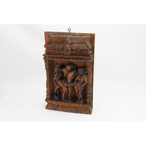 730 - An Indian Carved Erotic Panel depicting a couple in amorous pursuit & two embarrassed Onlookers. Mea... 