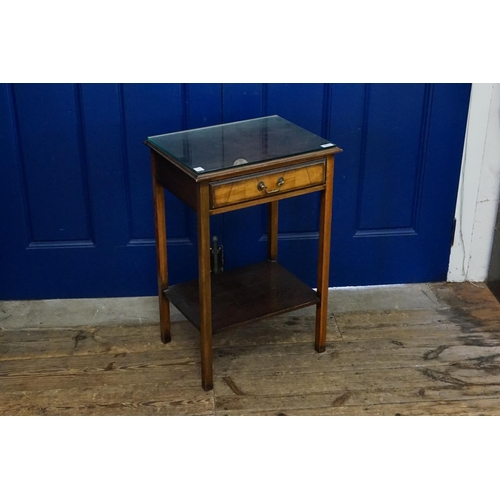 609 - A Mahogany & Walnut Veneered Single Drawer Lamp Table with a Glass Top. Measuring: 69cms high x 36cm... 