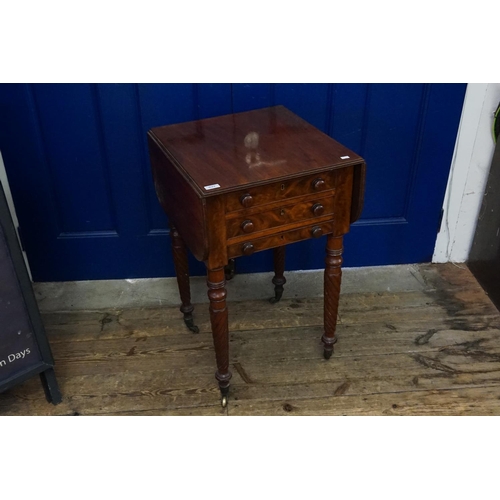 627 - A Scottish mahogany needlework table, resting on spiral legs with Drop flap sides.