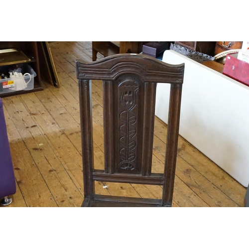 637 - A pair of antique oak side chairs, with carved back and turned legs, stretchers, with a good colour.