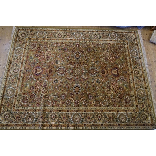 667 - An Olive Green Ground Double Floral bordered & Four Gul Central Medallion Carpet. Measuring: 360cms ... 