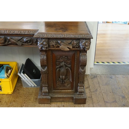 640 - A Victorian Heavily Carved Oak Revival Style Sideboard decorated with Game, Birds, a Carved Lion Mas... 