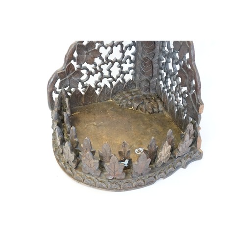 613 - A Bavarian Black Forest Corner Wall Shelf with pierced carved flowers & leaf decorated. Measuring: 5... 