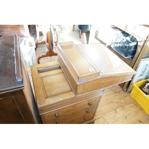 645 - An Edwardian Oak Davenport with a Sliding Top, Graduated Drawers, Pull-Out ink Drawer & a Tray Back.... 