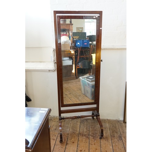 617 - A Swing Framed Cheval Mirror resting on a Shaped Stand.