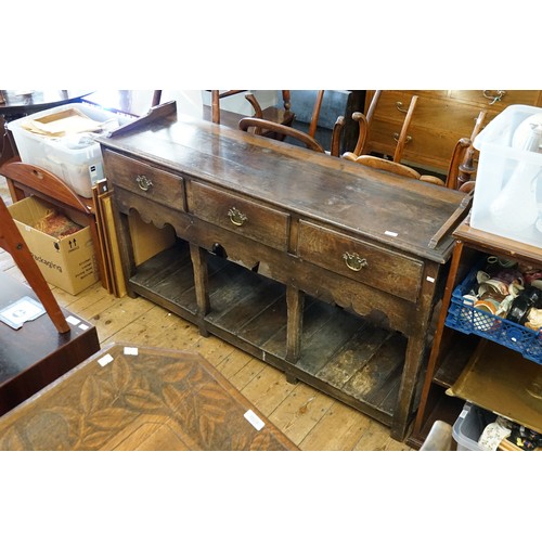 595 - An Antique Oak Three Drawers Dresser Base with Boarded Under Tier and Open Back, Resting on Square L... 